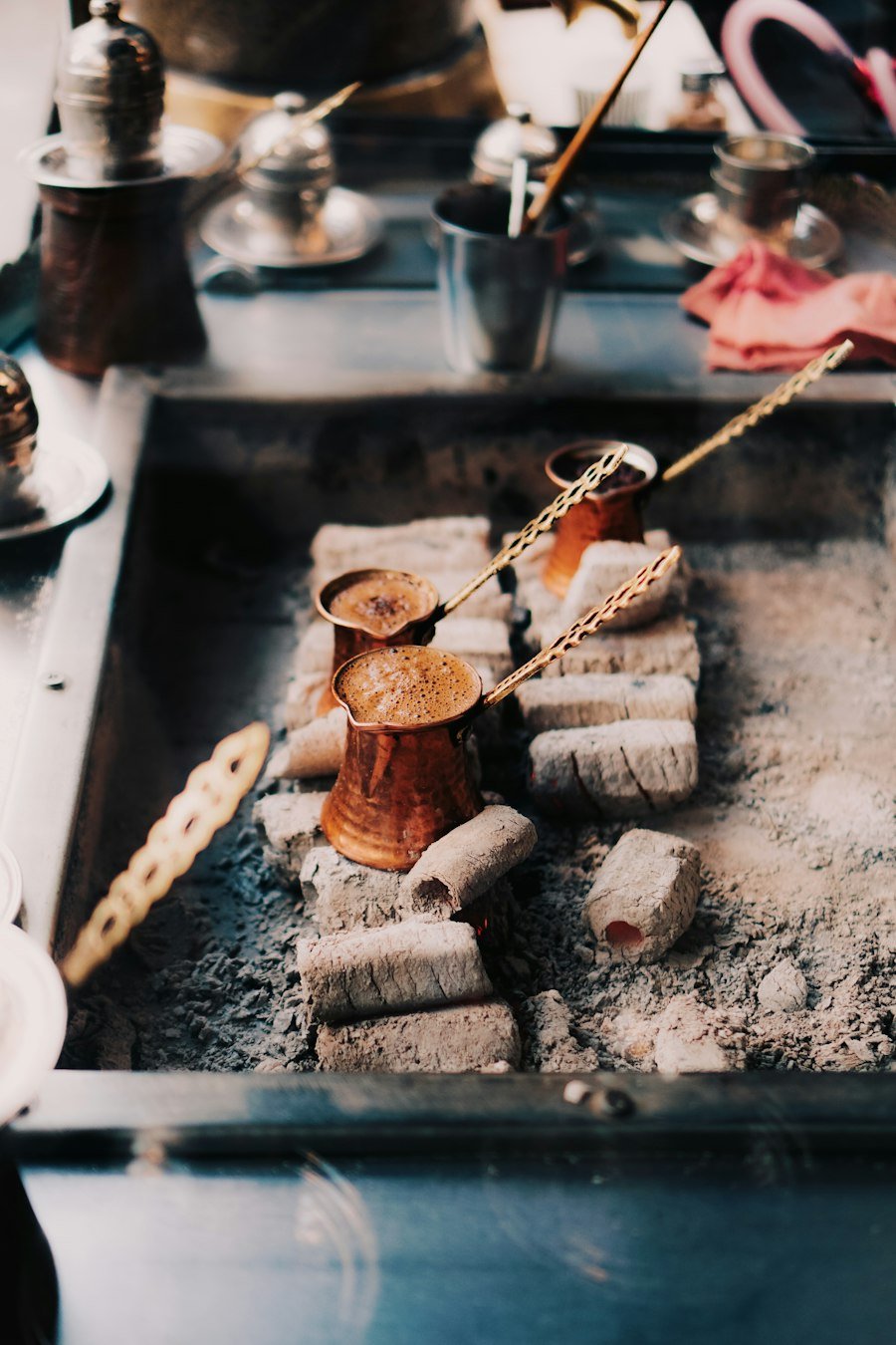 Turkish coffee brewing in a copper cezve